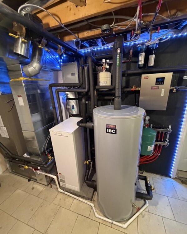 Copper hydronic piping and high-efficiency boiler installed by Kanata HVAC