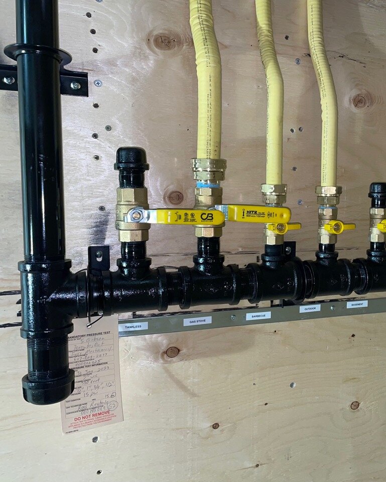 Full custom-home gas line manifold with labeled shutoffs, installed by Kanata HVAC